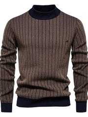 Brown ribbed stripe mock neck sweater with navy accents and a small metal detail on the chest.