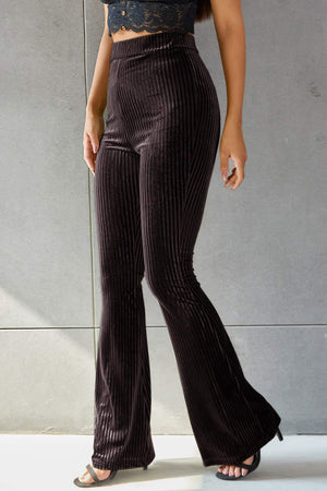 Ribbed velvet palazzo trousers in chocolate brown, high-waisted with a flared leg.