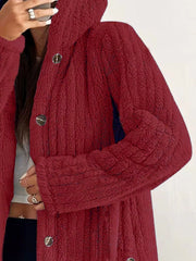 Red button-up fleece jacket with textured fabric and silver buttons.