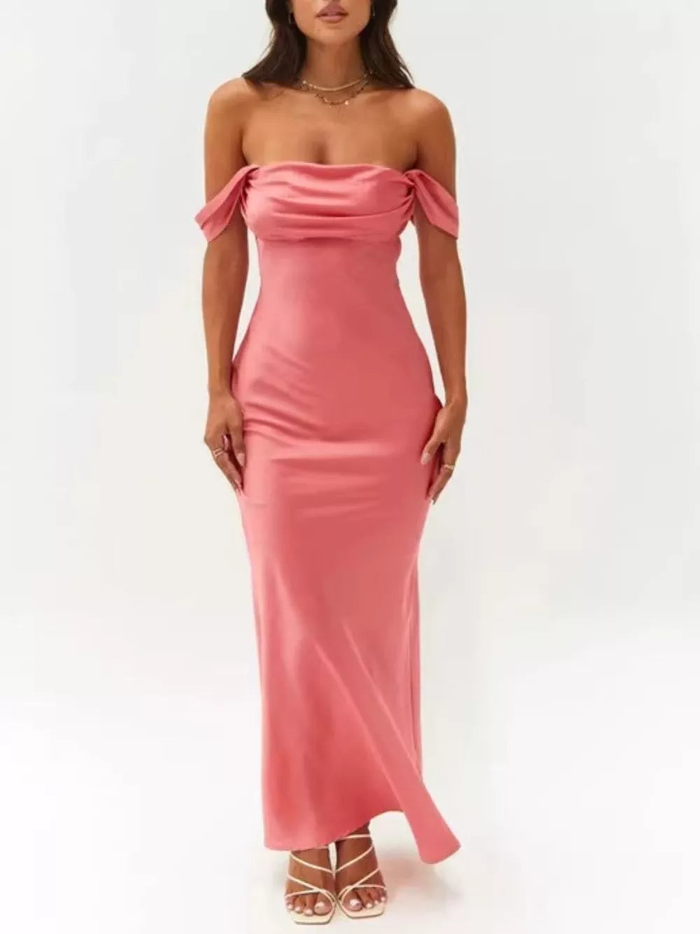 Coral satin off-shoulder maxi gown with draped neckline and bodycon fit.