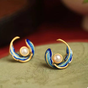Blue pearl feather earrings with gold accents