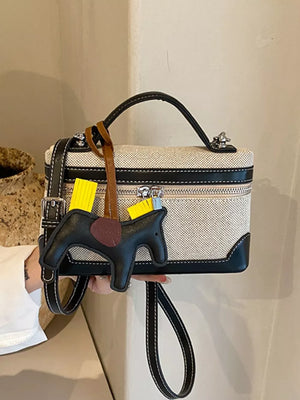 Top Handle Detachable Strap Mini Handbag in Black, close-up detail