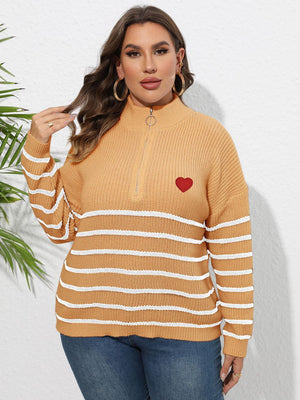 Tangerine ribbed knit sweater with white stripes, mock neck, quarter zip, and red heart appliqué.