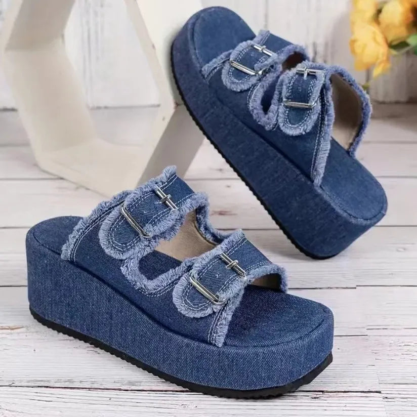 Denim platform slides with buckle straps and frayed edges in Moss color.