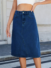 Dark blue denim midi skirt with panel seams and a classic five-pocket design.