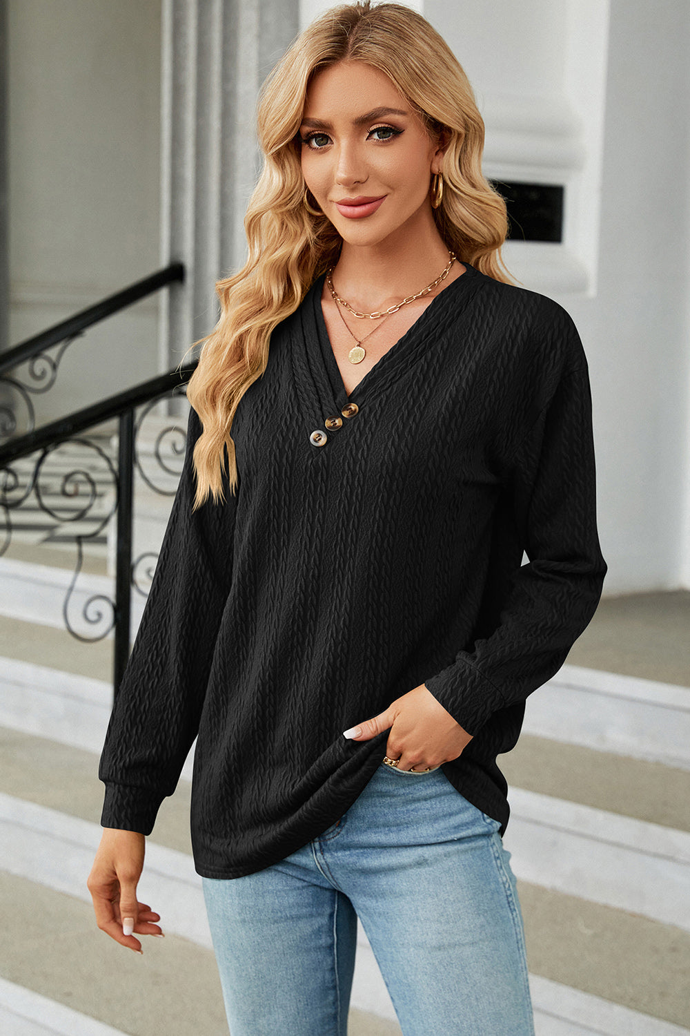 Black textured cable-knit henley pullover with V-neck and button detail