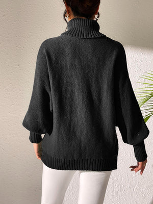 Black knit turtleneck sweater with balloon sleeves and ribbed details.