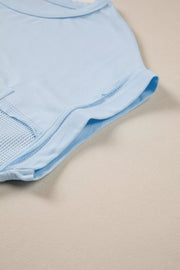 Light blue waffle knit pocketed t-shirt with curved hem detail