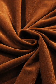 Brown velvet blouse with gathered sleeves and subtle shimmer detail.