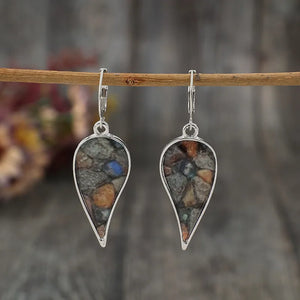 Silver teardrop mosaic earrings with colorful stone pattern detail.