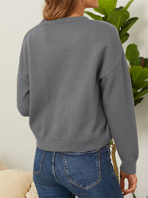 Grey V-neck cardigan with daisy embroidery detail on sleeve cuff.