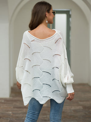 White knit sweater with boat neck, balloon sleeves, and scalloped detail.