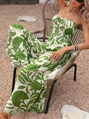 Green tropical print strapless jumpsuit with tie-front detail.