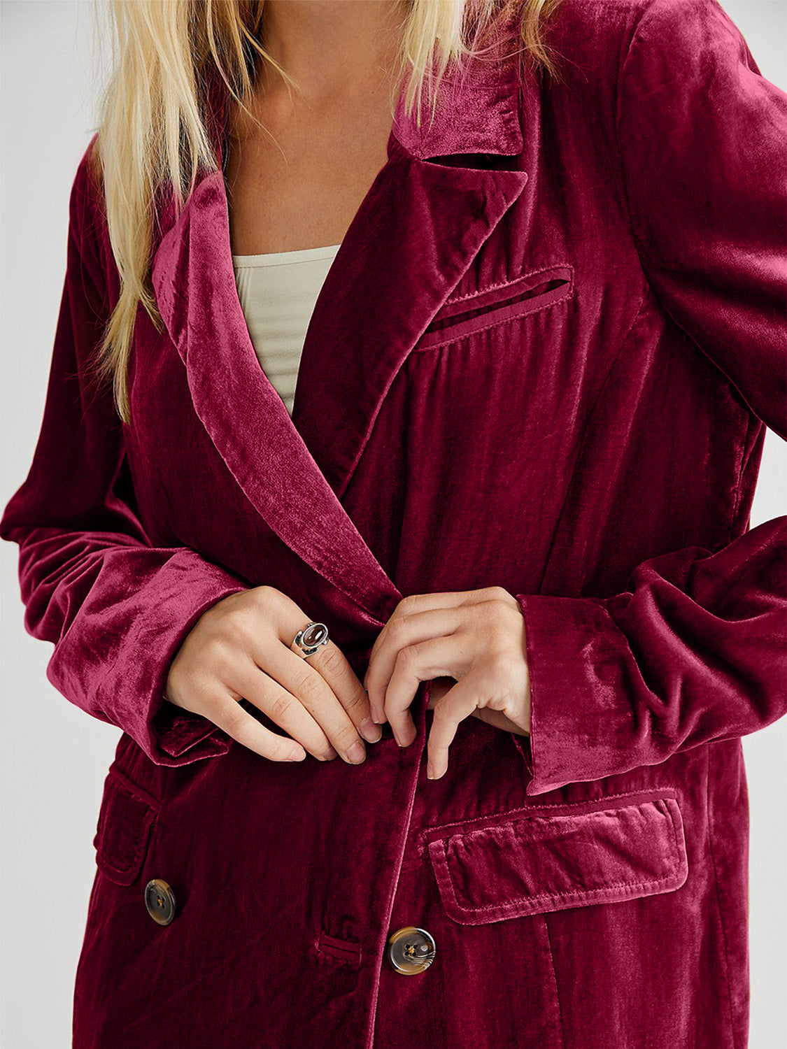Burgundy velvet double-breasted blazer with patch pockets and button closure.