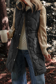 Black diamond quilted longline vest with cinched waist detail and snap front.