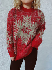 Red glitter snowflake knit sweater with a mock neck and long sleeves.