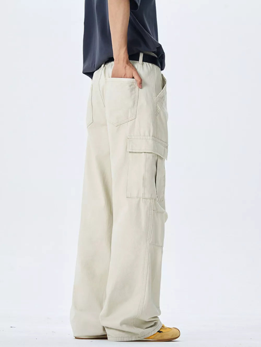 Off-white 100 cotton wide-leg cargo pants with multiple pockets and belt loops.