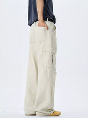 Off-white 100 cotton wide-leg cargo pants with multiple pockets and belt loops.