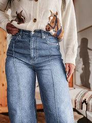Light blue denim wide-leg jeans with contrast stitching and buttoned pockets.