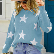 Crewneck sweater in Cloudy Blue acrylic with white star pattern and ribbed cuffs.