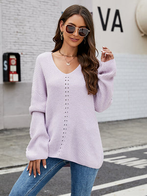 Light purple ribbed knit sweater with lace-up detail and V-neck.