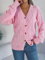 Blush pink cable knit balloon sleeve cardigan with button front and v-neck.