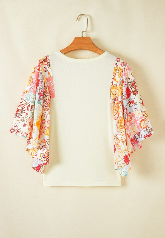 Beige t-shirt with patchwork floral print flutter sleeves.