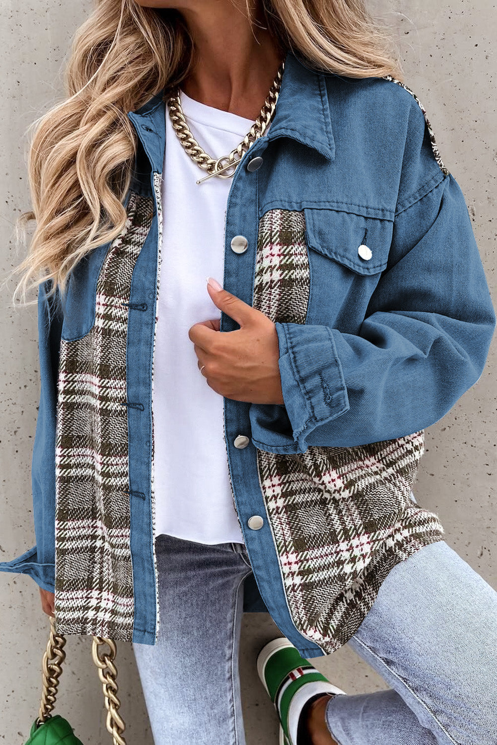 Light blue denim trucker jacket with plaid panels and button front.