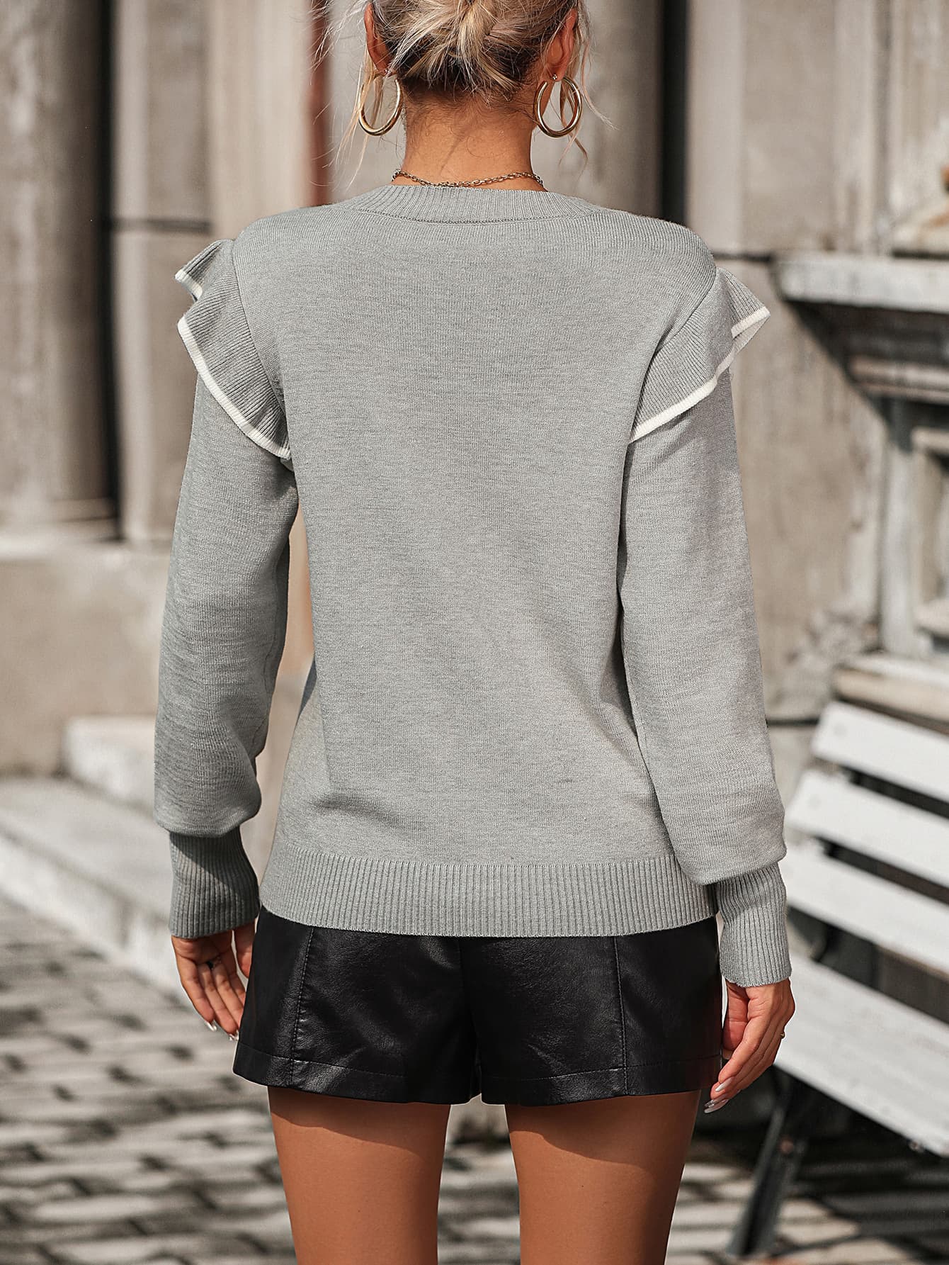 Light gray crew neck sweater with contrast trim ruffle shoulders