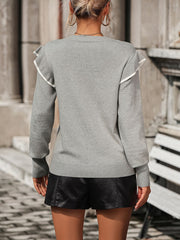 Light gray crew neck sweater with contrast trim ruffle shoulders