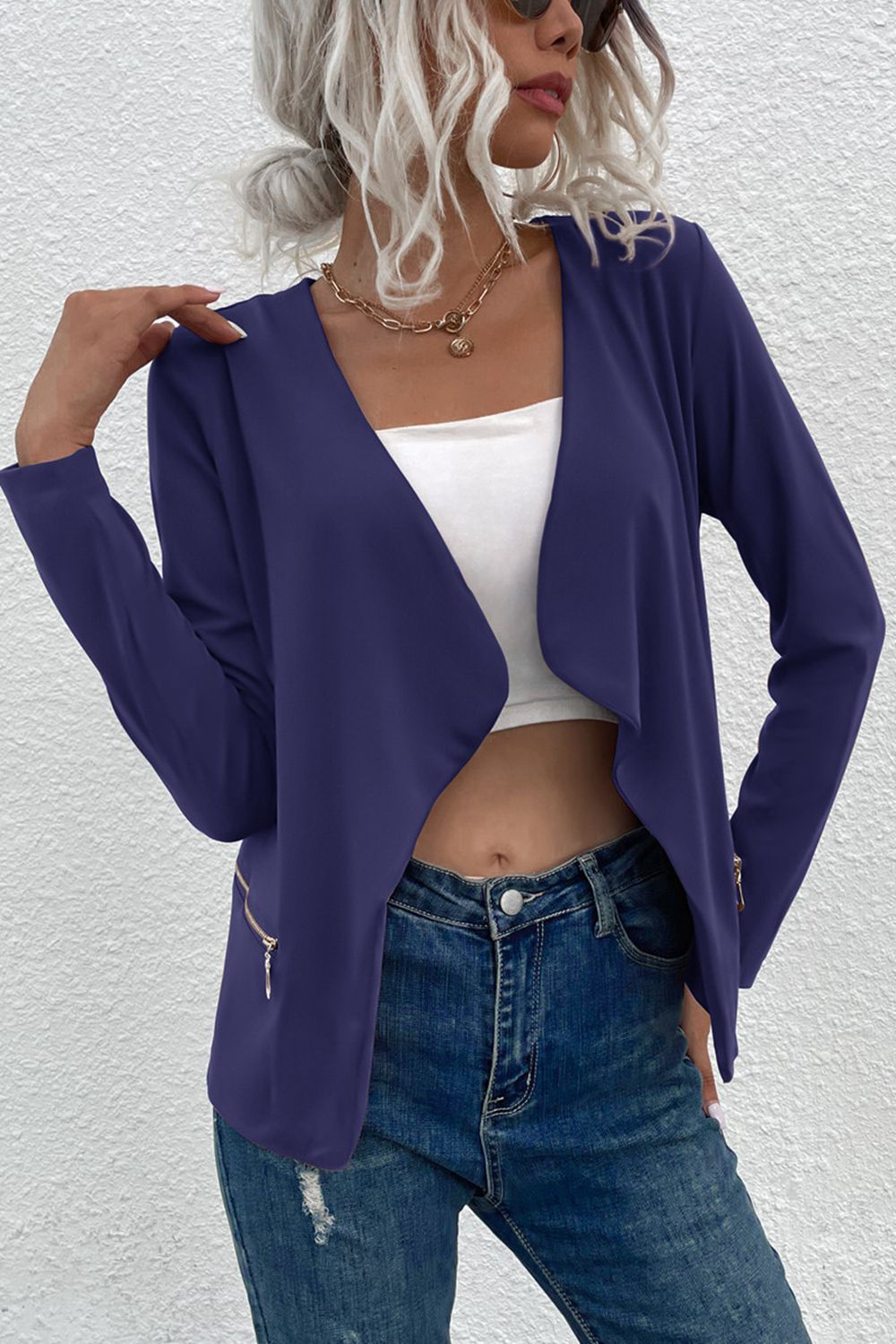 Dark blue drape front jacket with zip details and open neckline.