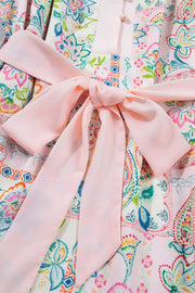 Floral patchwork mini dress with pink belt and button-down detail