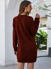 Burgundy sweatshirt dress with long sleeves and slant pockets, casual style.