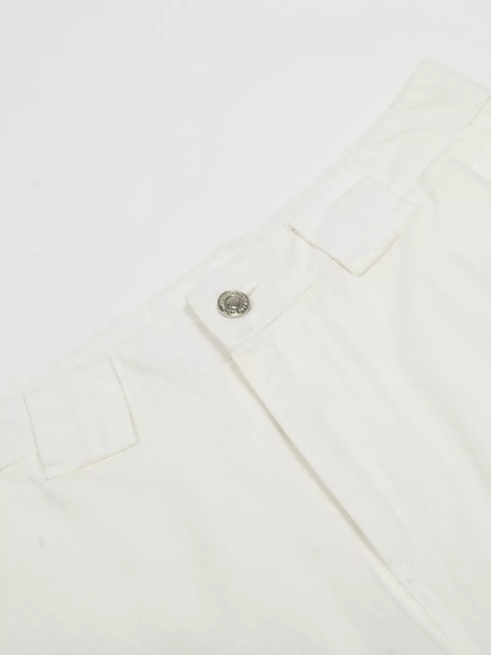 White men's capris with wide legs, a button closure, and belt loops.