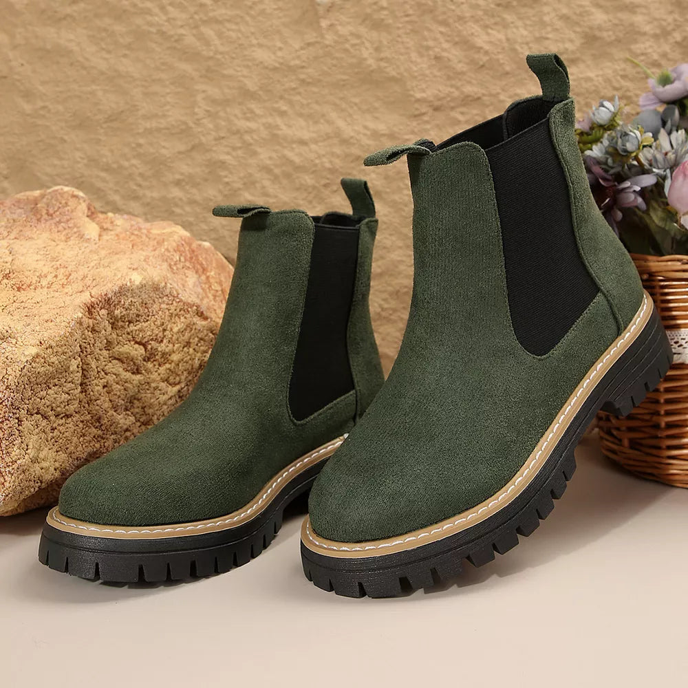 Green suede platform chelsea ankle boots with chunky sole and elastic side panels.