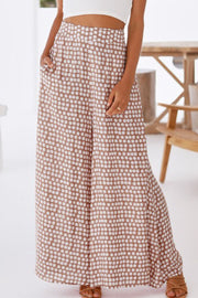 Polka dot wide leg culottes in dusty pink with pockets.
