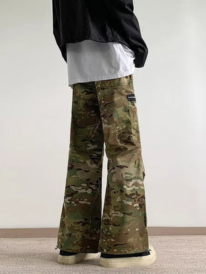 Oversized camouflage cargo pants with zipper pockets and a relaxed fit.