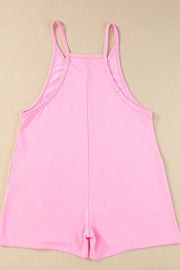 Pink spaghetti strap romper with patch pockets and a square neckline.