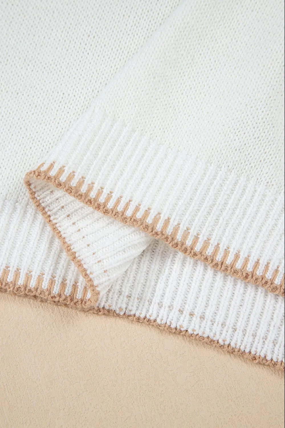 White knit sweater with contrast stitch trim detail