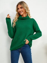 Textured knit oversized turtleneck pullover in dark green acrylic with a relaxed fit.