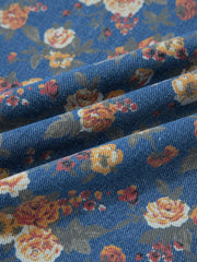 Floral denim overalls with adjustable straps and a vintage floral print.