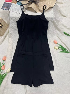 Black scoop neck cami and pocketed shorts set.