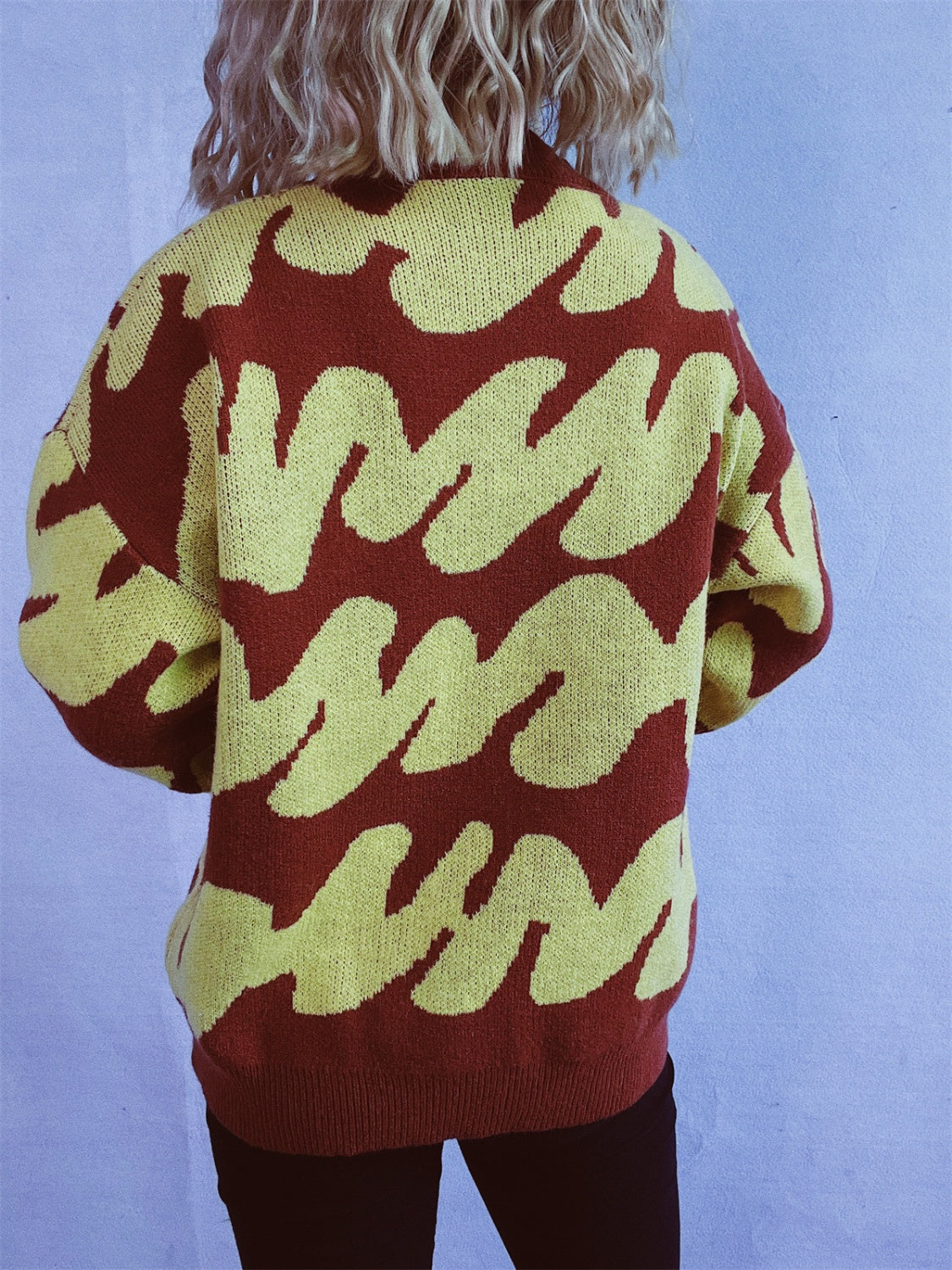 Graphic Wave Knit Sweater in Dark Brown and Light Yellow, featuring a bold abstract pattern.