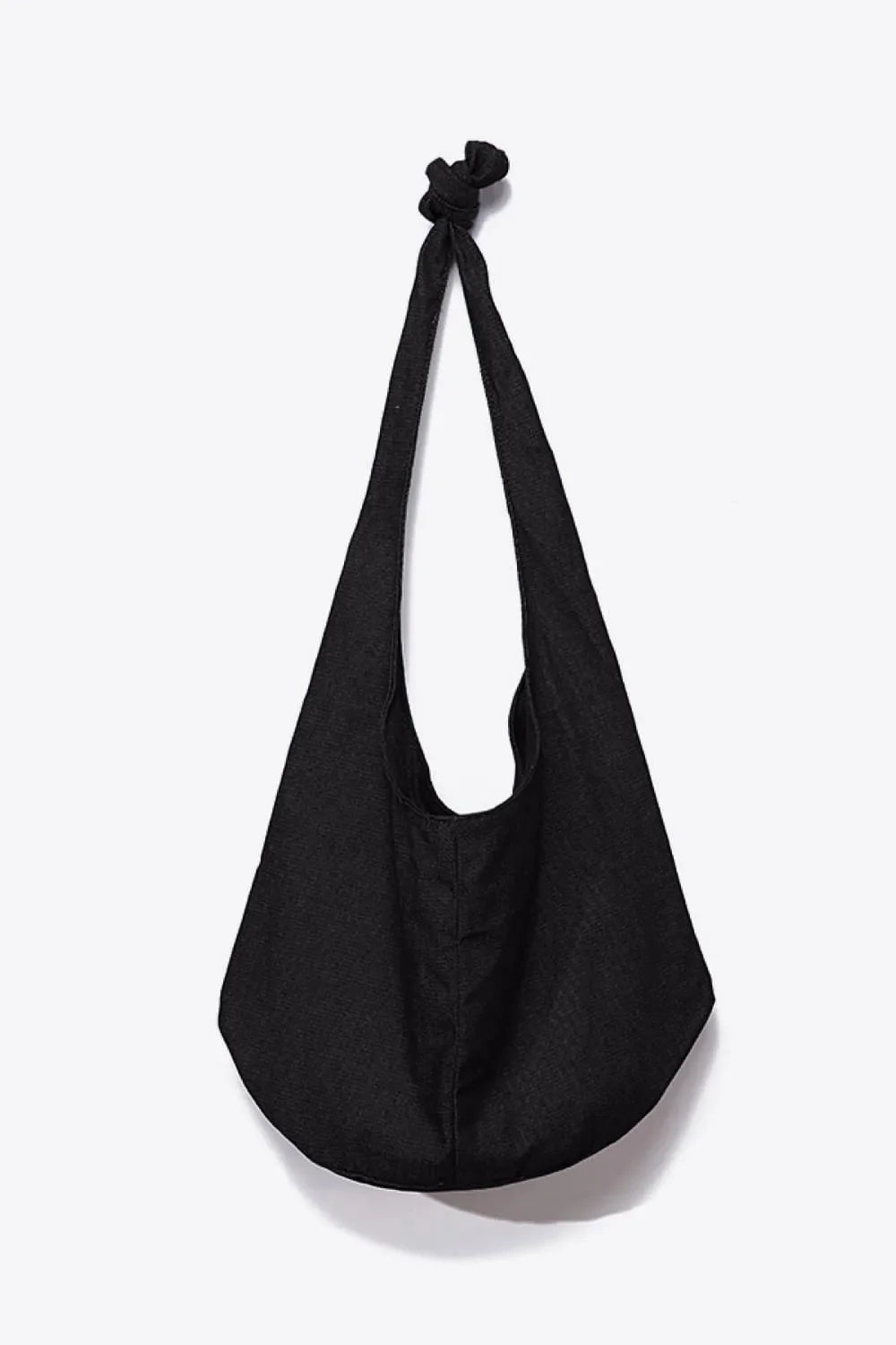 Black canvas shoulder bag with knotted strap detail
