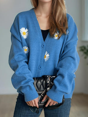 Sky blue acrylic oversized knit cardigan with embroidered daisies, button front, and V-neck.
