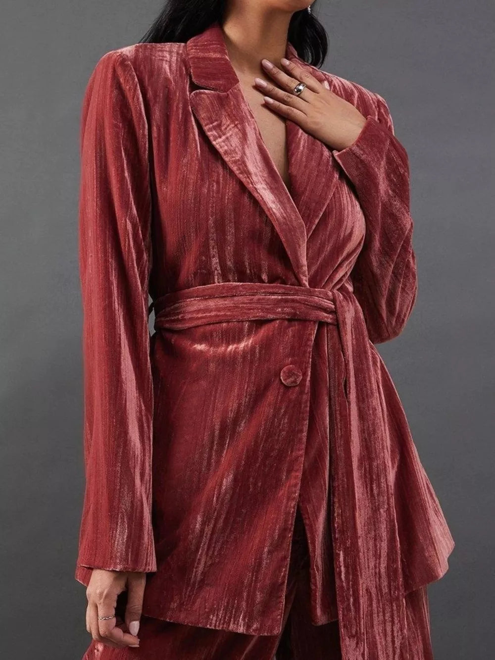 Burgundy velvet belted blazer and trousers ensemble with a single button closure.