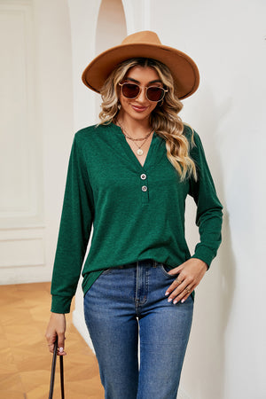 Dark green long sleeve henley top with button detail and v-neck