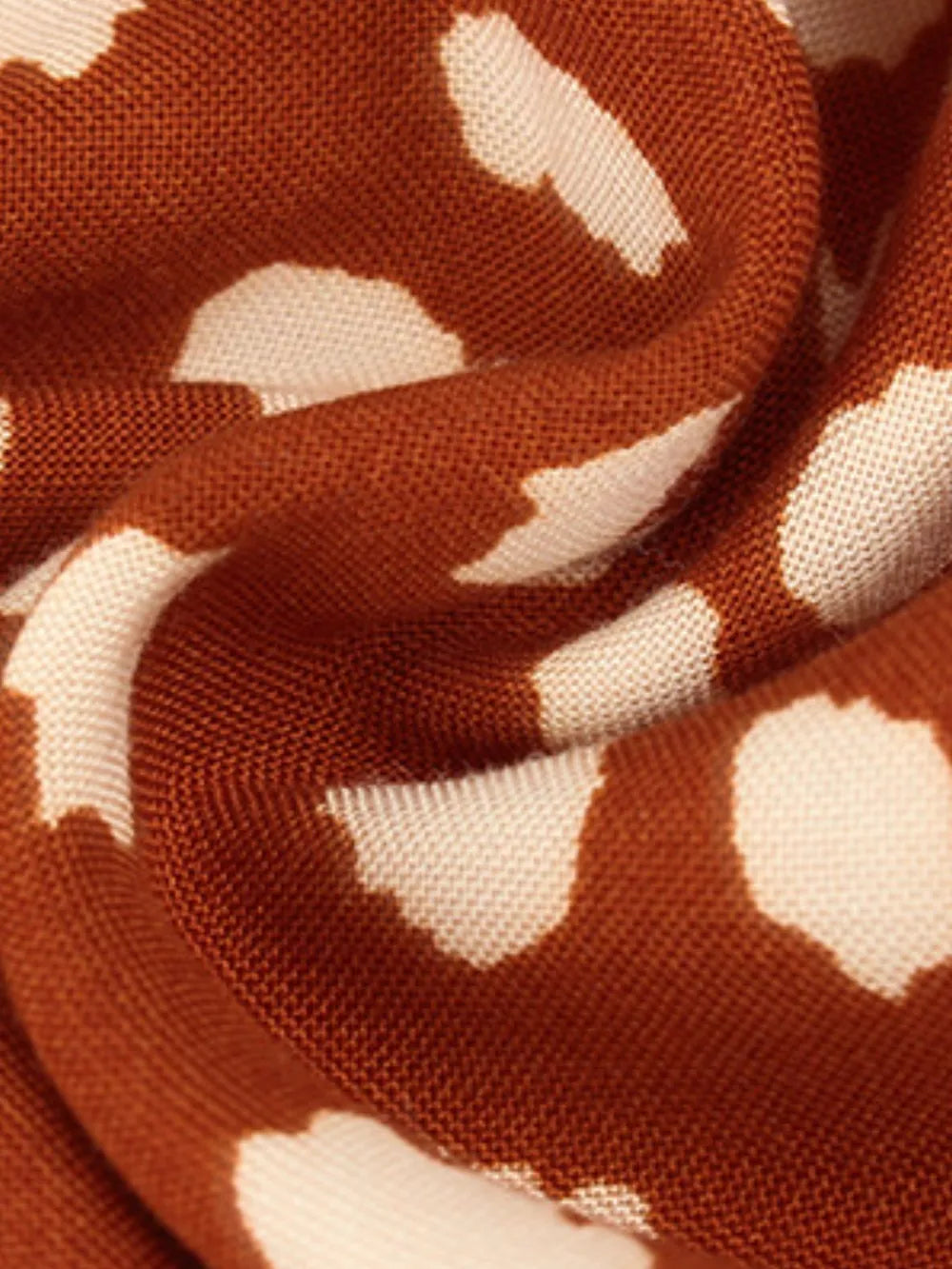 Orange animal print midi dress fabric detail with tied waist detail