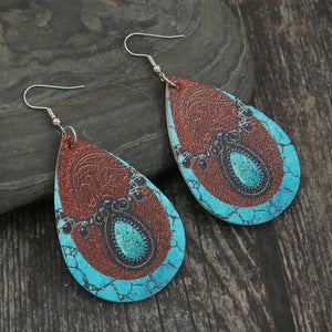 Teardrop cowhide earrings with turquoise and black accents