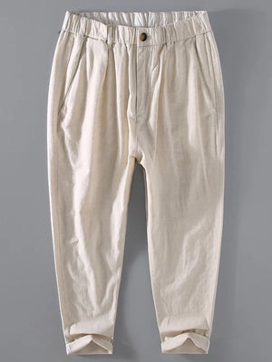 Men's beige relaxed fit cropped sweatpants with elastic waistband and cuffed hem.